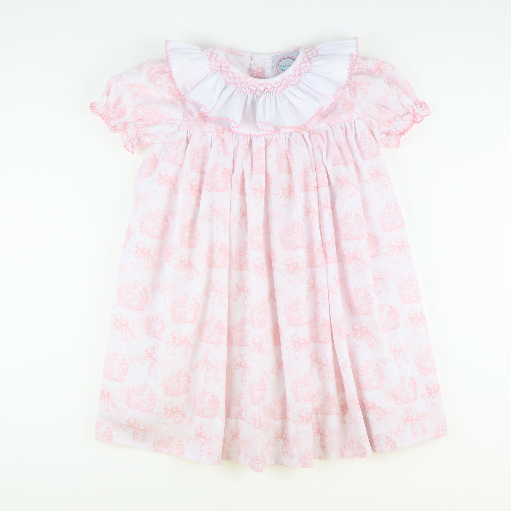 Smocked Ruffle Neck Dress- Pink Bunny Toile Smocked Ruffle Neck Dress- Pink Bunny Toile